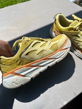 Hoka One One Yellow Suede Clifton Sneakers